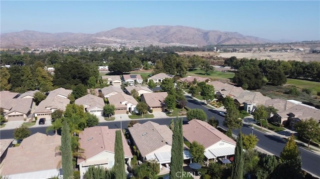 birds eye view of property featuring a mountain view