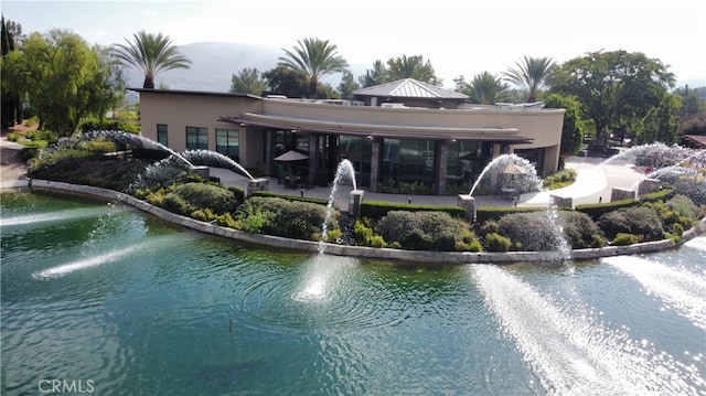 rear view of house with a water view