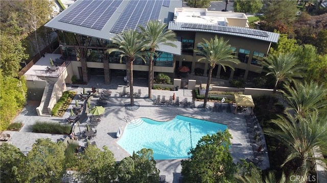 view of swimming pool with a patio