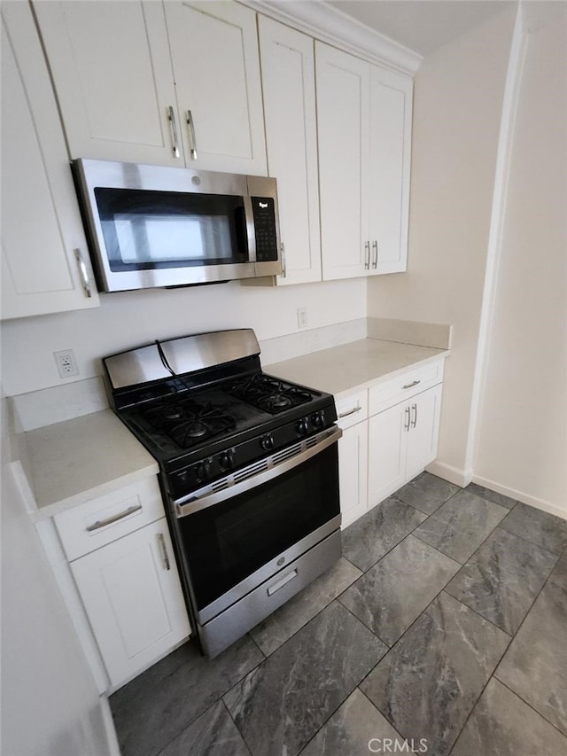 kitchen featuring white cabinetry and stainless steel appliances