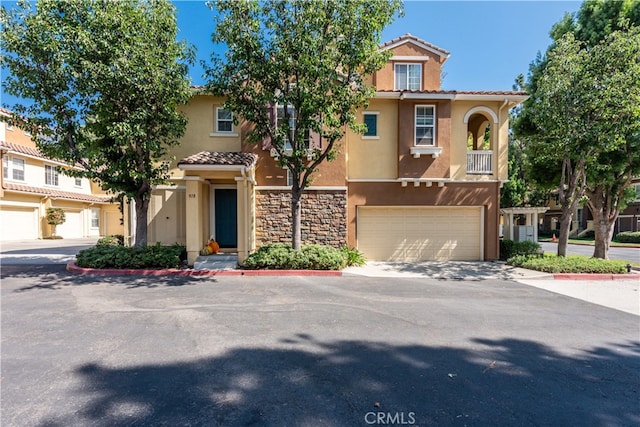 mediterranean / spanish-style house featuring a garage