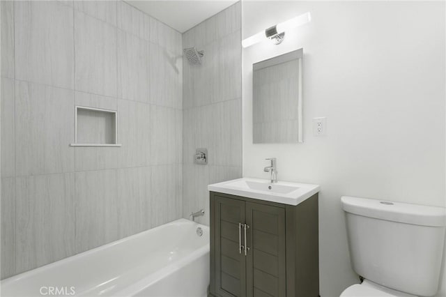 full bathroom with vanity, toilet, and tiled shower / bath combo