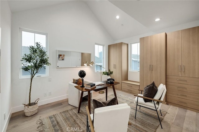 office with high vaulted ceiling, recessed lighting, light wood-style flooring, and baseboards