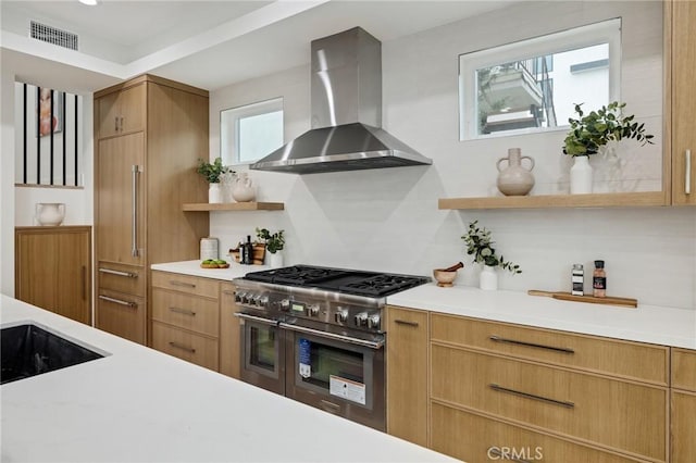 kitchen with open shelves, visible vents, light countertops, double oven range, and wall chimney exhaust hood