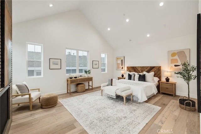 bedroom featuring high vaulted ceiling, recessed lighting, light wood-style floors, and baseboards