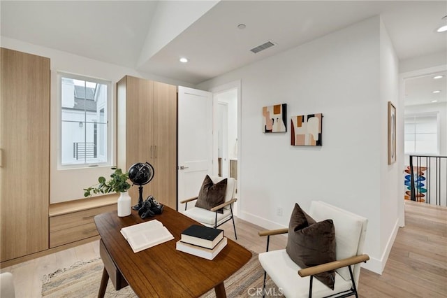 office space with light wood finished floors, baseboards, visible vents, and recessed lighting