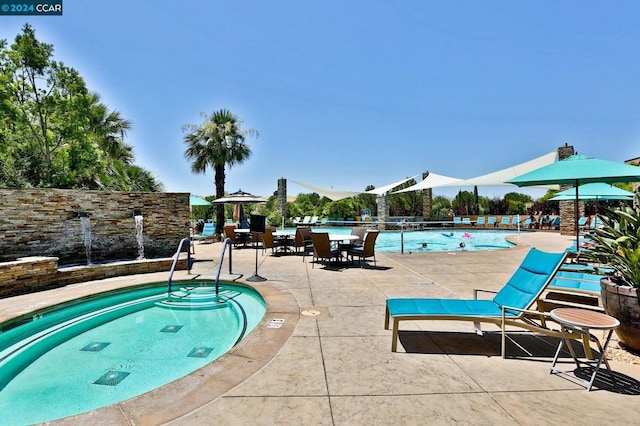 view of pool featuring a patio and a mountain view