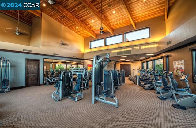 exercise room with wood ceiling, carpet flooring, a high ceiling, and ceiling fan