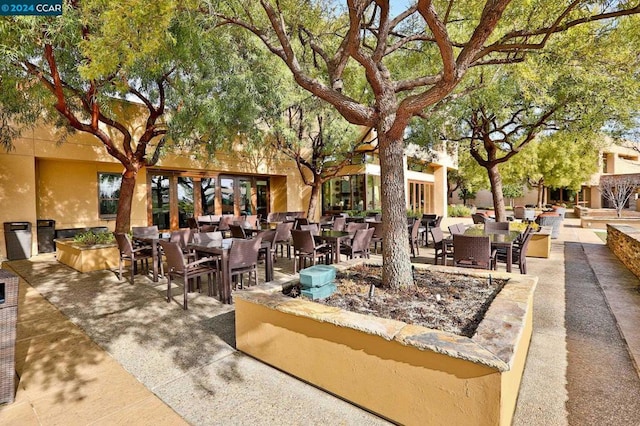 surrounding community featuring a patio area