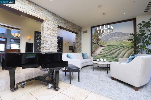 living area with an inviting chandelier and light tile patterned flooring