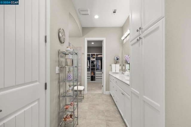 bathroom with vanity and tile patterned floors