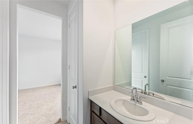 bathroom with vanity and baseboards