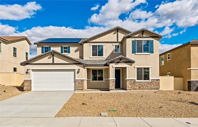 craftsman house with stucco siding, driveway, stone siding, a garage, and solar panels