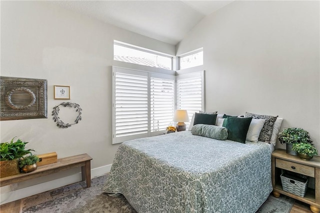 bedroom featuring lofted ceiling