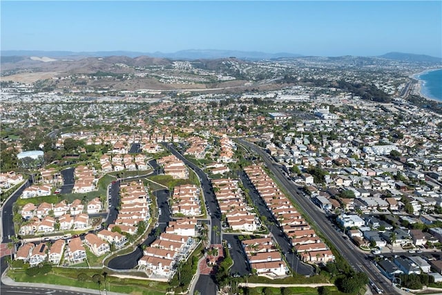 aerial view featuring a water and mountain view