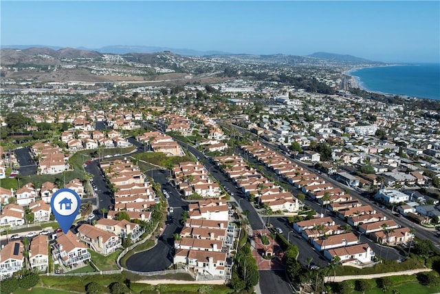 birds eye view of property featuring a water and mountain view