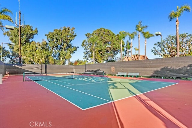 view of sport court featuring basketball hoop