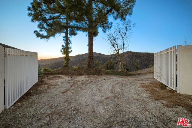 yard at dusk with a mountain view