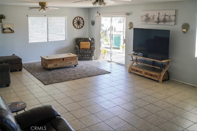 living room featuring ceiling fan and light tile patterned floors