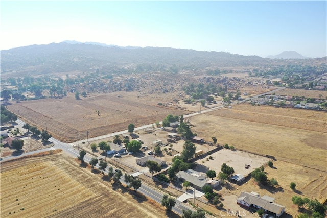 drone / aerial view featuring a mountain view and a rural view