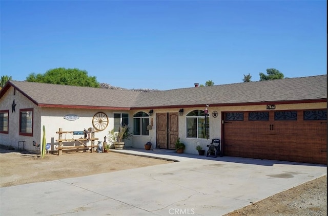 single story home with a garage