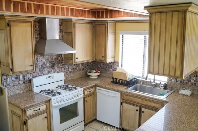 kitchen with wall chimney exhaust hood, white appliances, tasteful backsplash, and sink