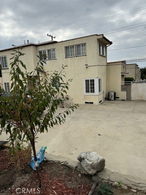 back of property featuring a patio