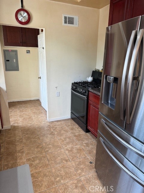 kitchen featuring electric panel, stainless steel fridge with ice dispenser, and black range with gas stovetop