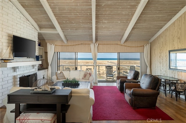 living room featuring a brick fireplace, wood-type flooring, lofted ceiling with beams, and wooden ceiling