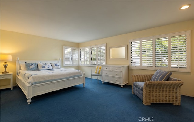 bedroom featuring dark colored carpet