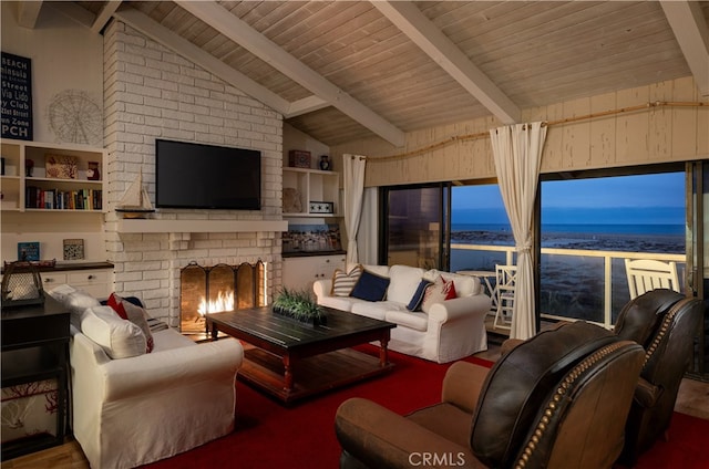 living room featuring vaulted ceiling with beams, wood ceiling, and a brick fireplace