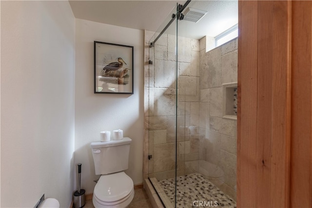 bathroom with walk in shower and toilet