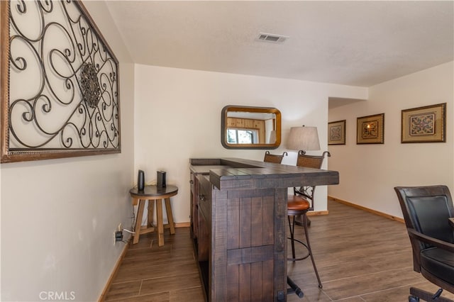 office area featuring dark wood-type flooring