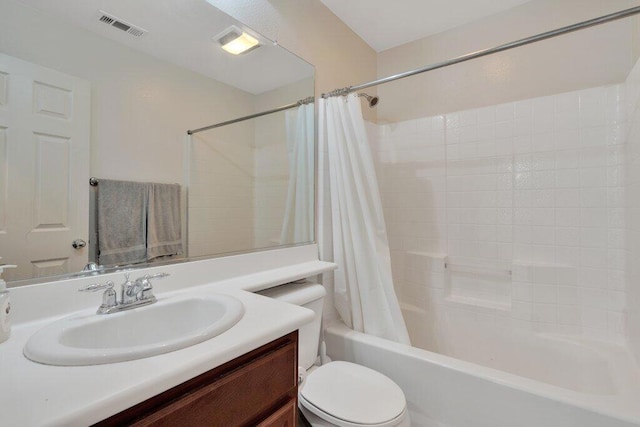 full bathroom with vanity, toilet, and shower / bath combo with shower curtain