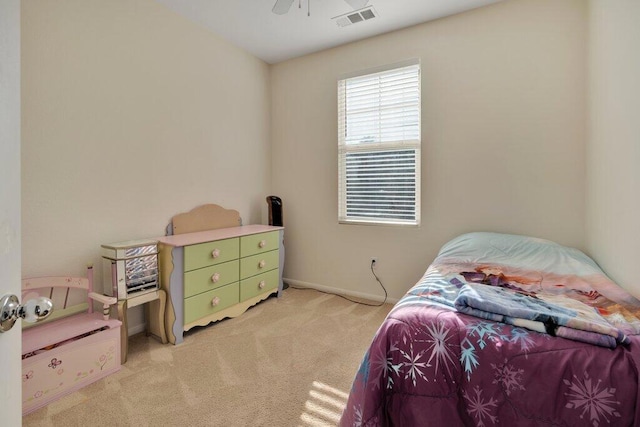 bedroom with ceiling fan and light colored carpet