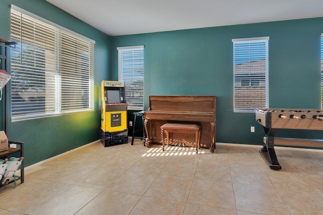 living area featuring light tile patterned floors and a wealth of natural light