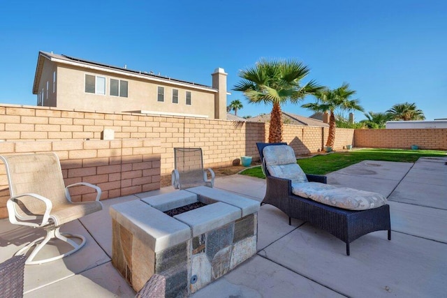 view of patio / terrace featuring a fire pit