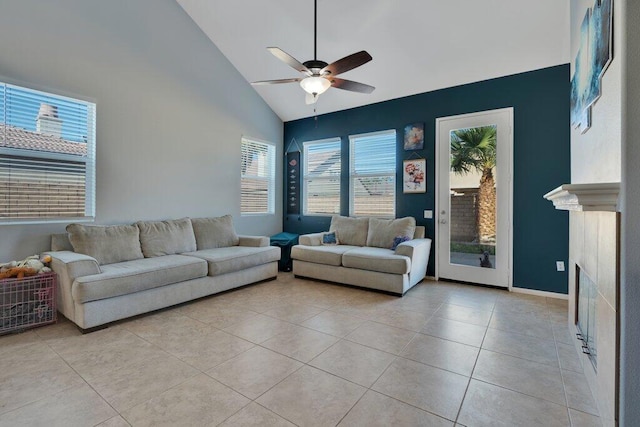 tiled living room featuring high vaulted ceiling, a wealth of natural light, and ceiling fan