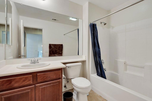 full bathroom with tile patterned floors, vanity, toilet, and shower / bath combo