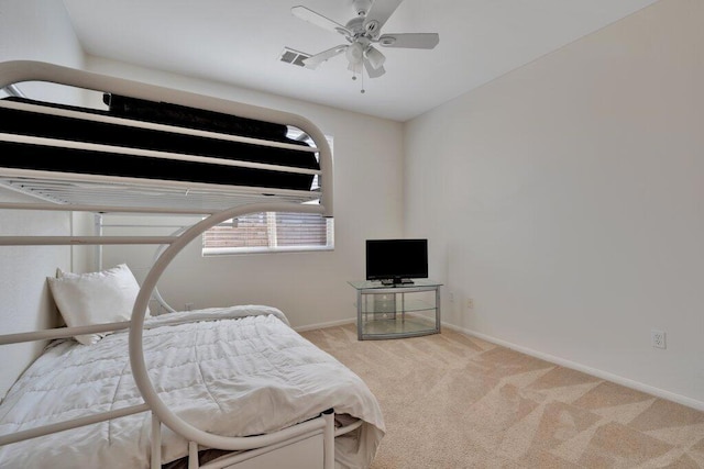 bedroom with light colored carpet and ceiling fan