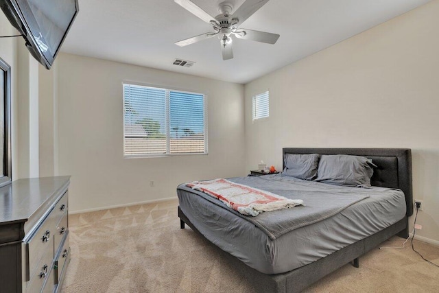 bedroom with light carpet and ceiling fan