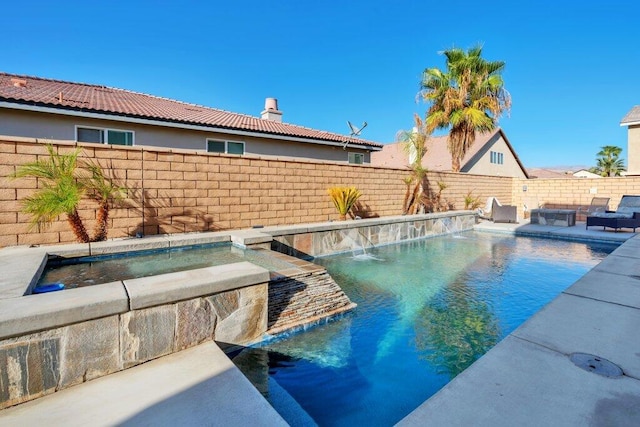 view of pool with pool water feature and a jacuzzi