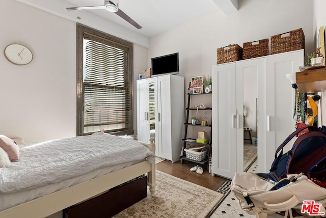 bedroom featuring ceiling fan and dark wood-type flooring