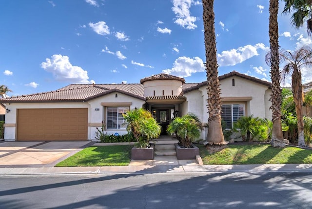 mediterranean / spanish-style home with a garage