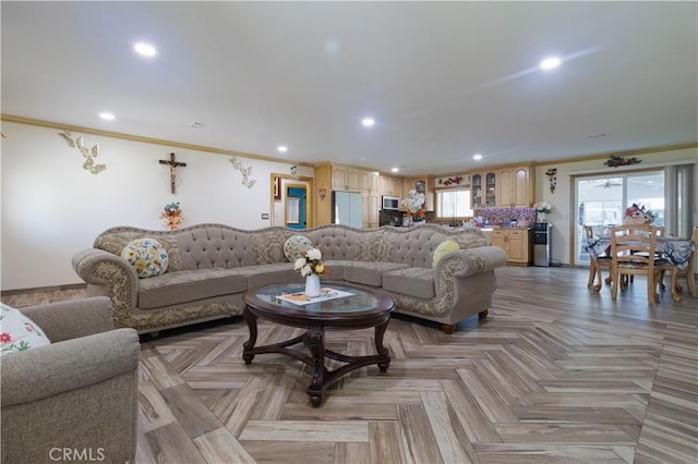 living room featuring light parquet floors and crown molding