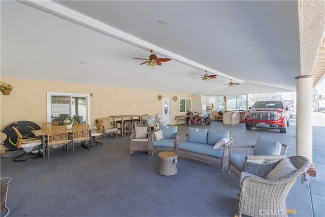 interior space featuring ceiling fan and outdoor lounge area