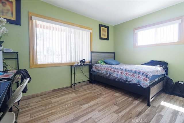 bedroom with light hardwood / wood-style flooring