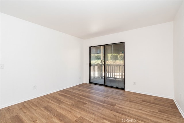 unfurnished room featuring hardwood / wood-style floors