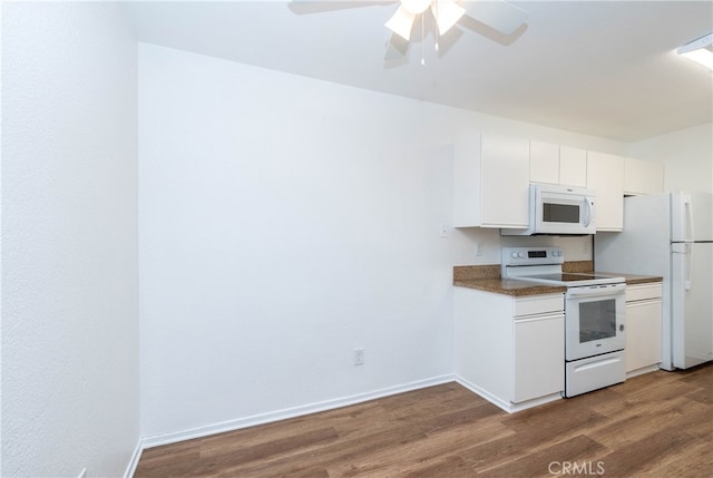 kitchen with white appliances, white cabinetry, dark hardwood / wood-style floors, and ceiling fan