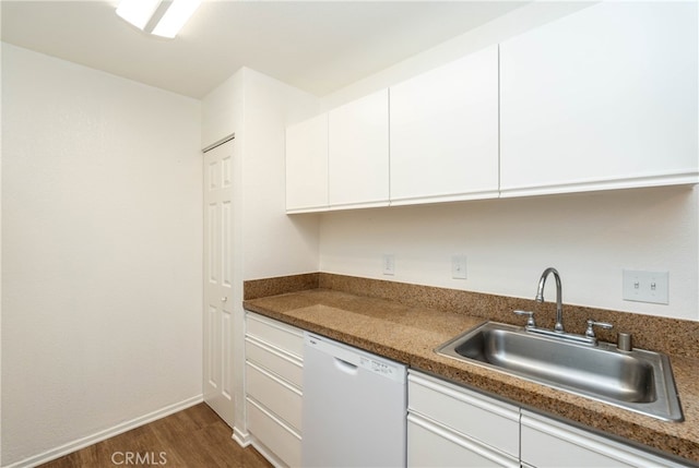 kitchen featuring dark stone counters, dishwasher, sink, white cabinets, and dark hardwood / wood-style flooring